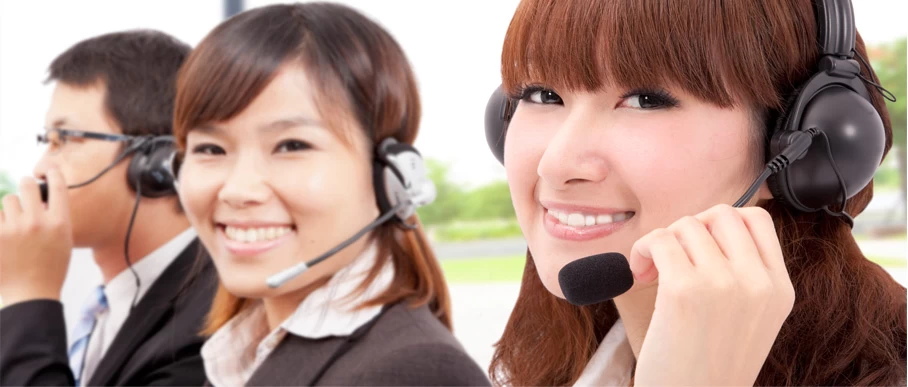 Customer service representatives wearing headsets