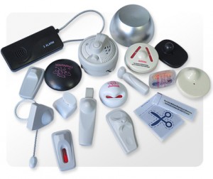 Assorted EAS anti-theft devices including hard tags, alarming tags, labels and a magnetic detacher